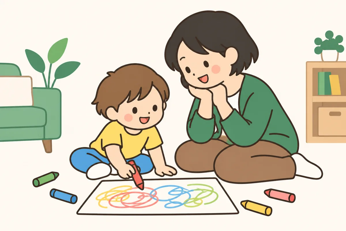 床で子どもがクレヨンで線や丸を描き、大人が楽しそうに見ている