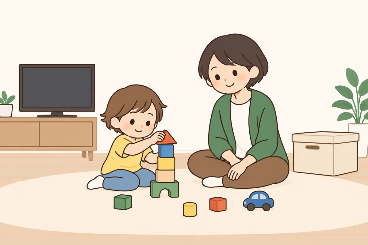 床に置いたおもちゃ数個で、子どもが積み木に集中している