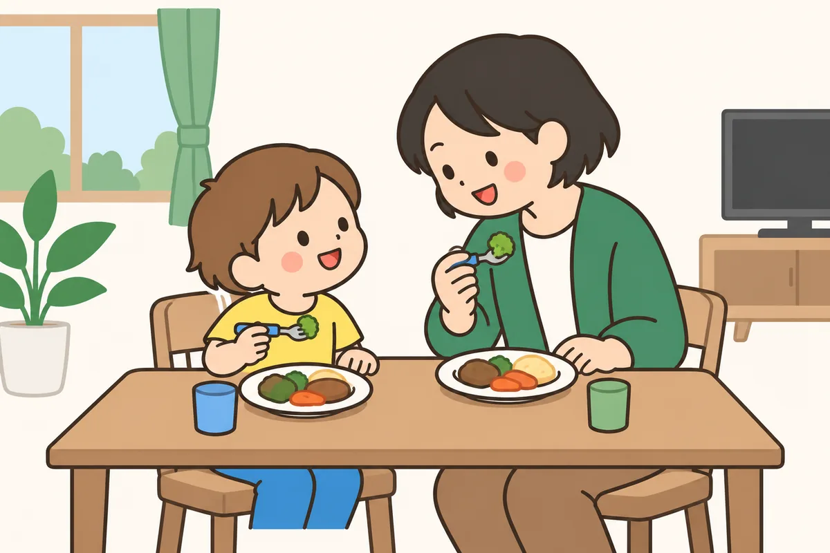テレビを消した食卓を、家族で囲んでいる