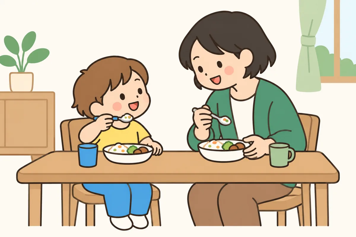 大人と子どもが向かい合って、のんびり食事をしている