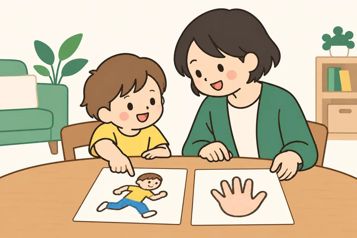 テーブルで、子どもと大人が絵を描いたカードを一緒に見ている