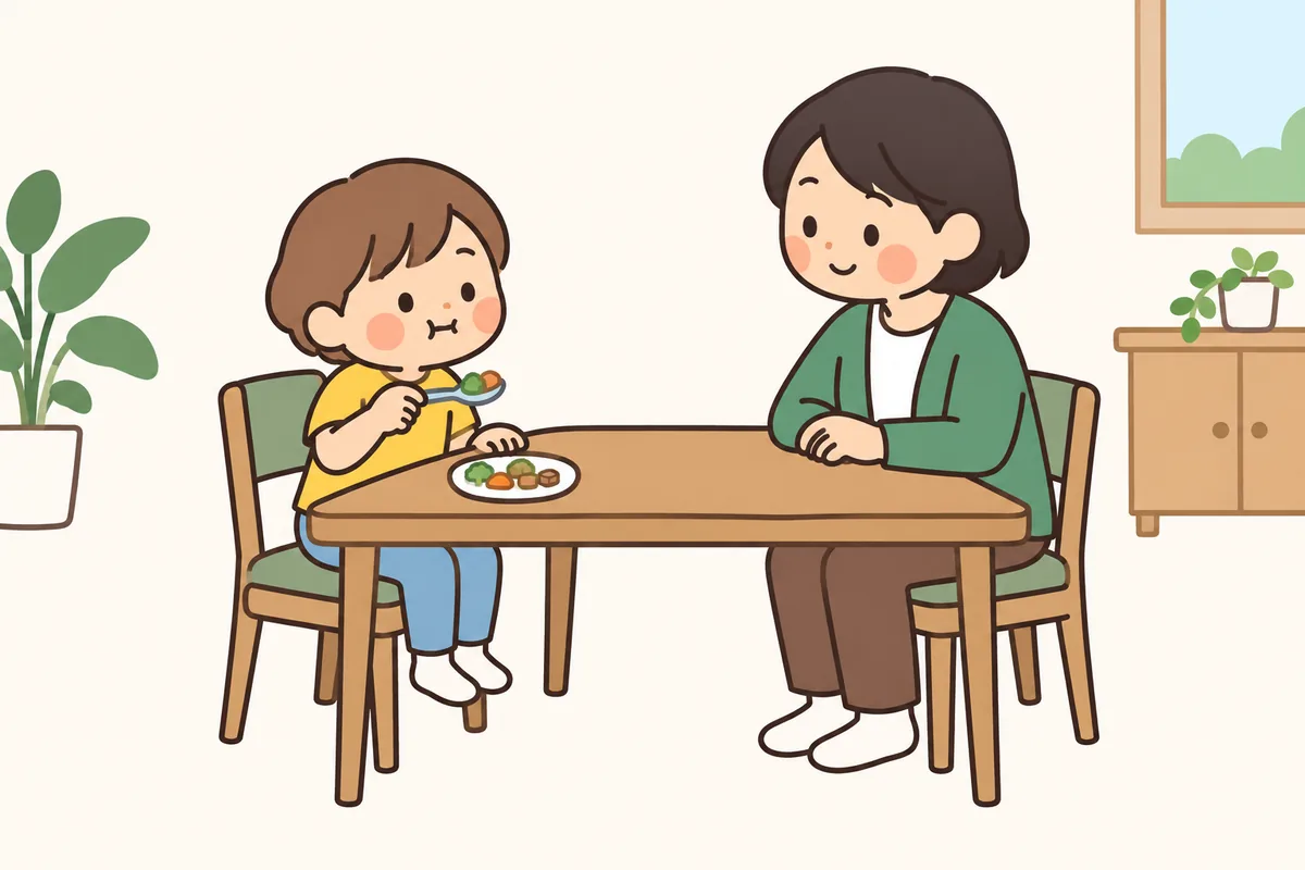 小さく切ったおかずを、子どもがもぐもぐかみ、大人がうなずいて見ている