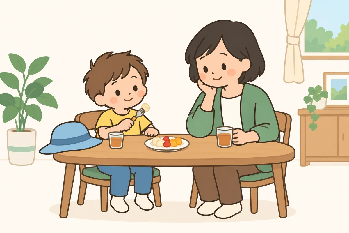 小さなお皿に少しだけ盛ったおやつを、テーブルで食べる子どもと大人