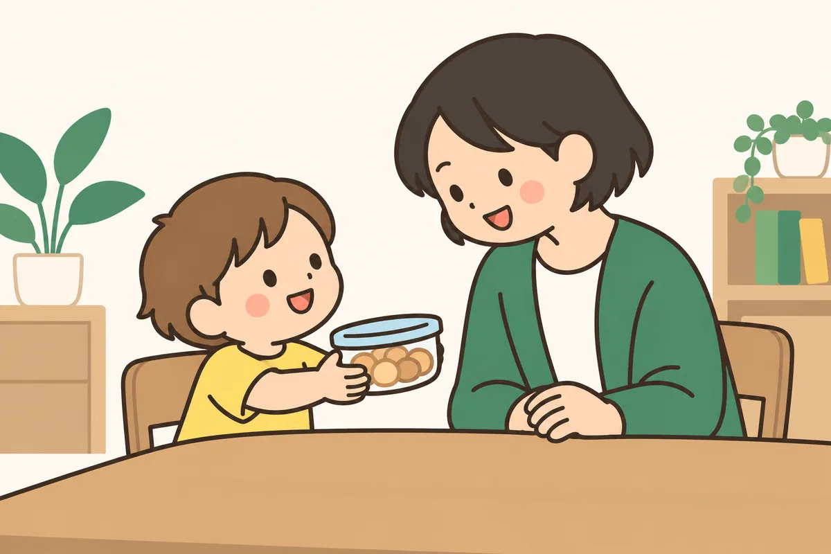 透明な容器に入ったおやつを、子どもが大人に差し出している